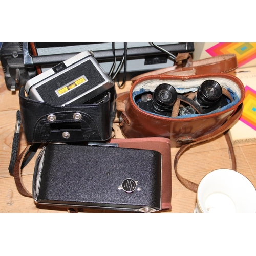 116 - Roberts Radio, a pair of French binoculars, a camera, a Polaroid camera, etc.