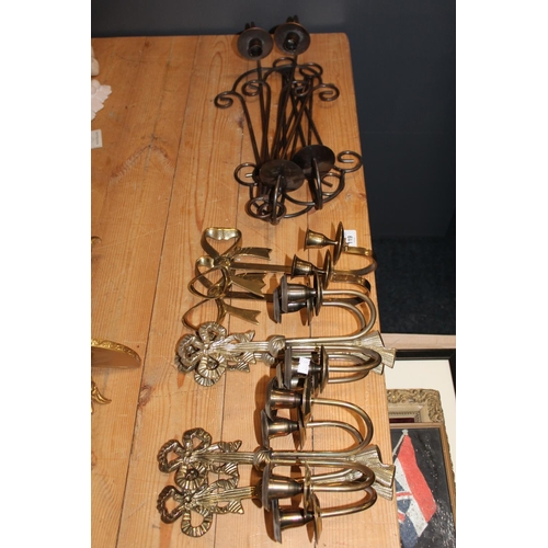 119 - Brass and metal wall mountable candle sconces.