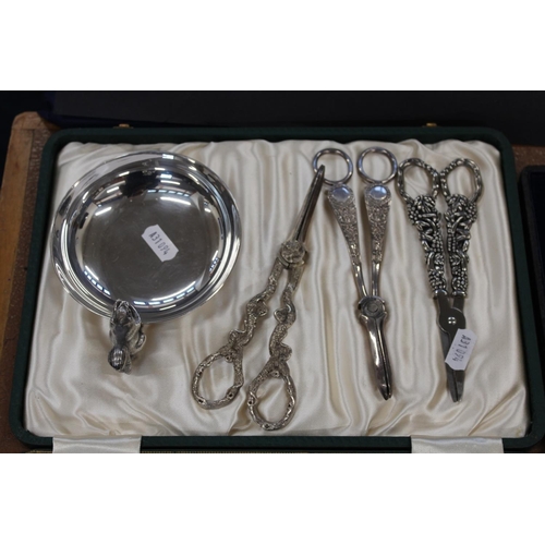 130 - Silver-plated flatware to include fish servers, knives and forks, grape scissors, etc.