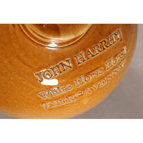 166 - John Harrhy White Horse Hotel Abergavenny stoneware flagon.