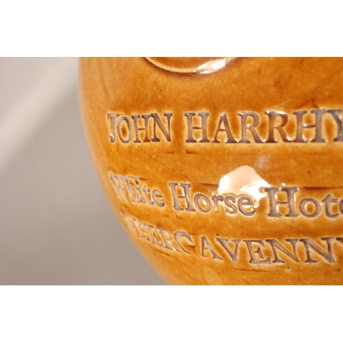 166 - John Harrhy White Horse Hotel Abergavenny stoneware flagon.