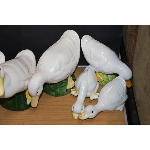 167 - Eight pottery duck models.