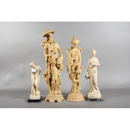 83 - Four resin style figures.