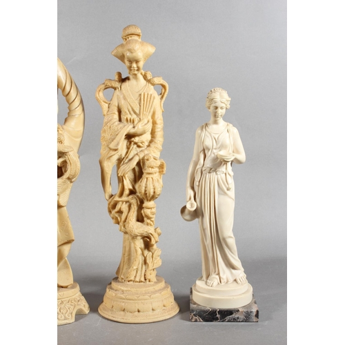 83 - Four resin style figures.