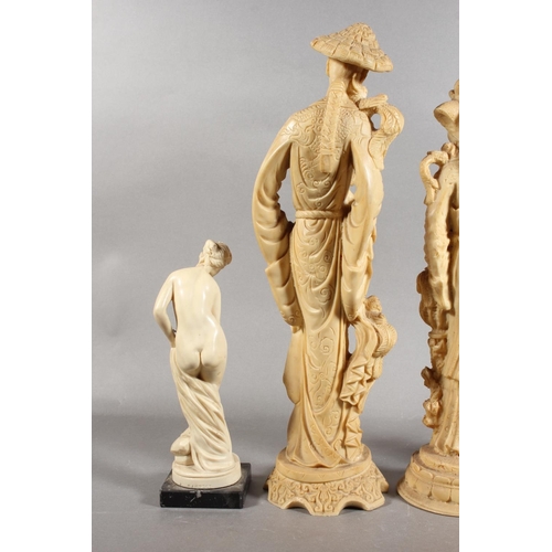 83 - Four resin style figures.