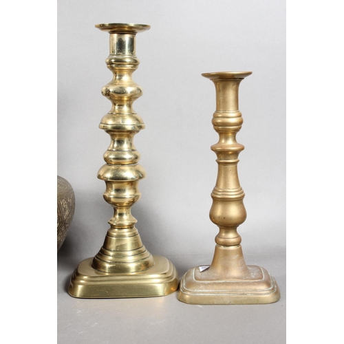 84 - Two pairs of brass candlesticks and a pair of Eastern decorated brass pots.