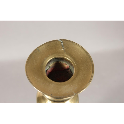 84 - Two pairs of brass candlesticks and a pair of Eastern decorated brass pots.