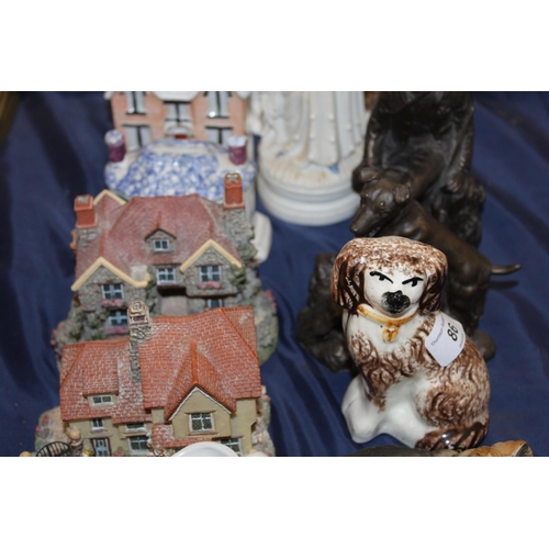 86 - Figure groups, Staffordshire style money banks, crested ware, etc.