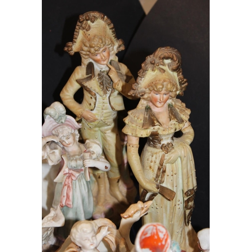 87 - Staffordshire flatback spill vase, a pottery basket with figural decoration, and other figure groups... 