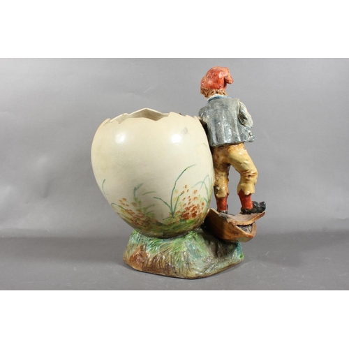 92 - Pottery vase depicting a boy in vintage dress.