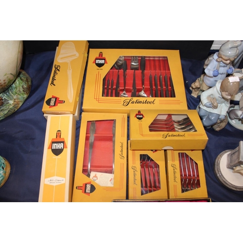 96 - Inca of Norway flatware, a cased set of knives, a cake topper, etc.