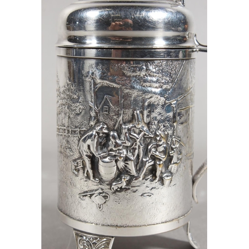 172 - Danish white metal lidded stein decorated in repousse with musicians, 14cm high.