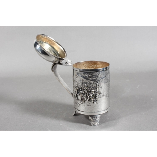 172 - Danish white metal lidded stein decorated in repousse with musicians, 14cm high.