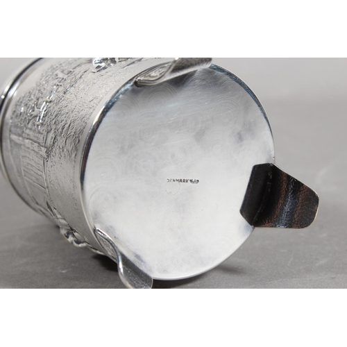 172 - Danish white metal lidded stein decorated in repousse with musicians, 14cm high.