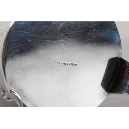 172 - Danish white metal lidded stein decorated in repousse with musicians, 14cm high.