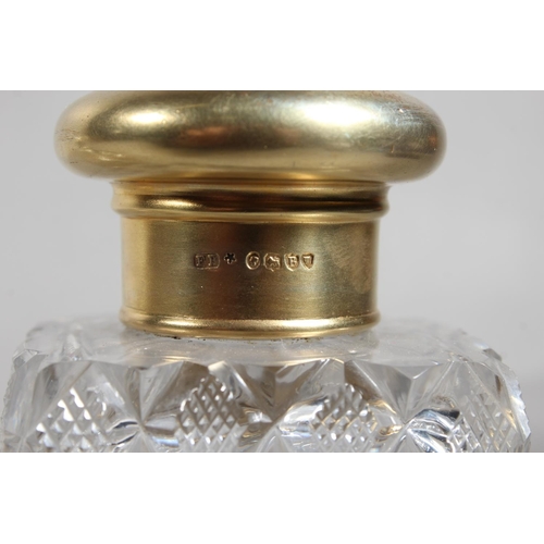 174 - Victorian cut-glass scent bottle with silver gilt cover, 13cm high, and another of globular form wit... 