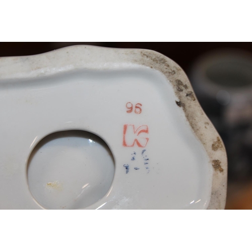 175 - USSR porcelain model of a girl holding a flower and book, 20cm high, and a similar figure group.