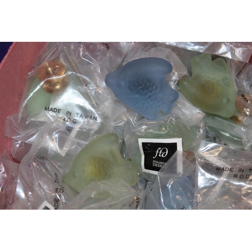 182 - Box containing FTD Finger Tip Design frosted glass doorknobs.