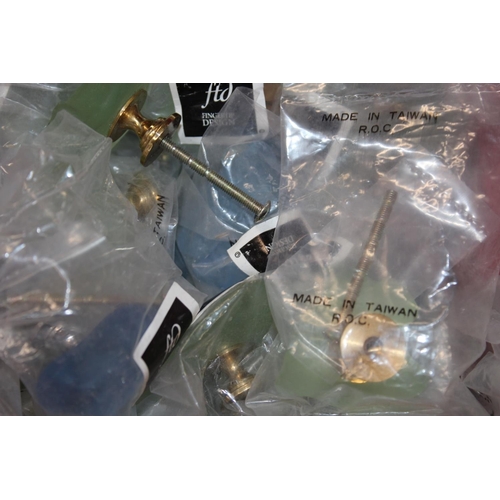 182 - Box containing FTD Finger Tip Design frosted glass doorknobs.