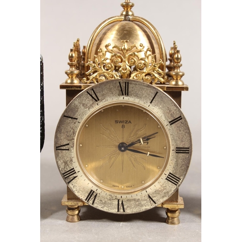 202 - Swiza of Switzerland 8-day lantern clock, and a pair of metal bottle holders in the forms of Scotsme... 