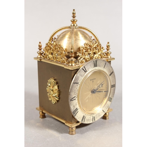 202 - Swiza of Switzerland 8-day lantern clock, and a pair of metal bottle holders in the forms of Scotsme... 