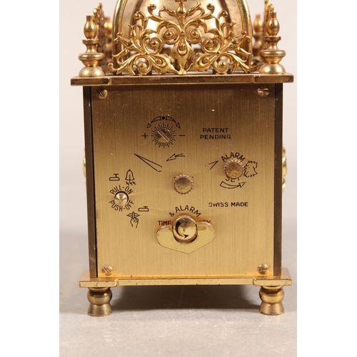 202 - Swiza of Switzerland 8-day lantern clock, and a pair of metal bottle holders in the forms of Scotsme... 