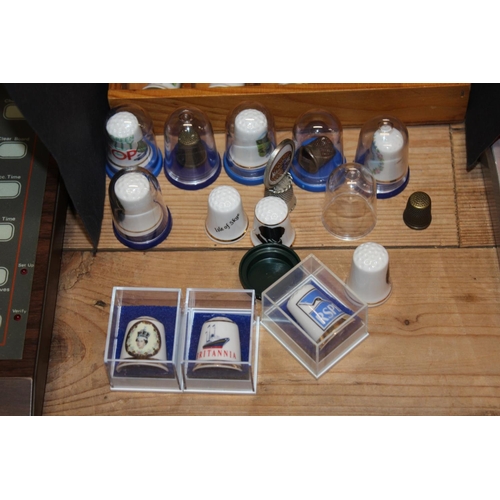 208 - Thimble collection held over three wall display stands, and others loose.