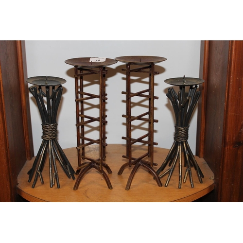 76 - Two pairs of metal candlesticks.