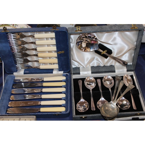 124 - Silver-plate to include flatware, spoons, a christening spoon, etc.