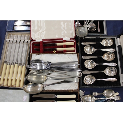 124 - Silver-plate to include flatware, spoons, a christening spoon, etc.