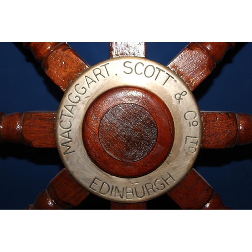 557A - Ships wheel with brass central panel inscribed MacTaggart Scott and Co Ltd.