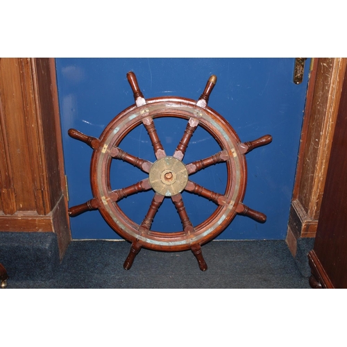 557A - Ships wheel with brass central panel inscribed MacTaggart Scott and Co Ltd.