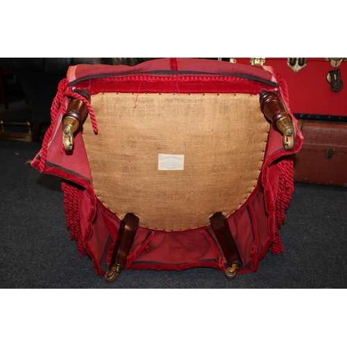 557C - Red upholstered bedroom chair.