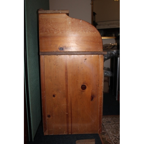 562 - Pine roll top desk.