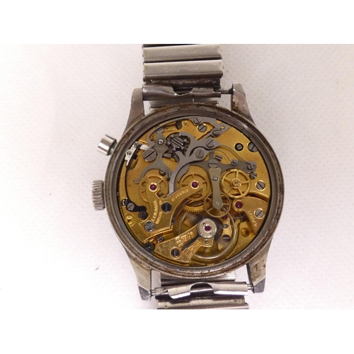 91 - Lemania. A Royal Navy military issue monopusher chronograph wristwatch, having black dial with lumin... 