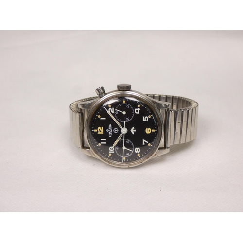 91 - Lemania. A Royal Navy military issue monopusher chronograph wristwatch, having black dial with lumin... 