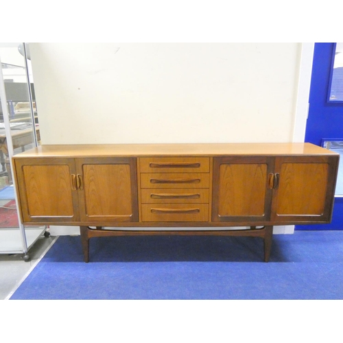 G-plan mid century teak sideboard with four central drawers flanked by double cupboards with cup handles.