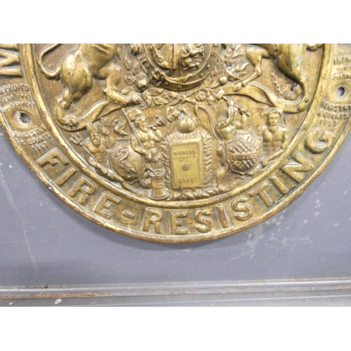 410 - Victorian Milner's of Liverpool Patent, fire proof lidded safe, raised on a wooden stand. Height 58c... 