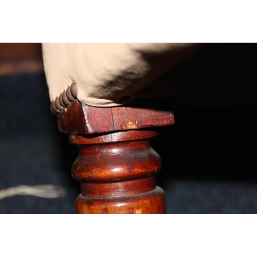 545 - Antique mahogany armchair, raised on fluted supports with brass castors.
