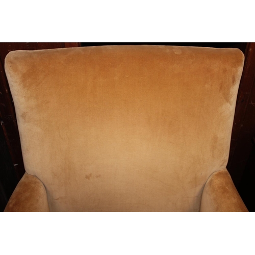 545 - Antique mahogany armchair, raised on fluted supports with brass castors.