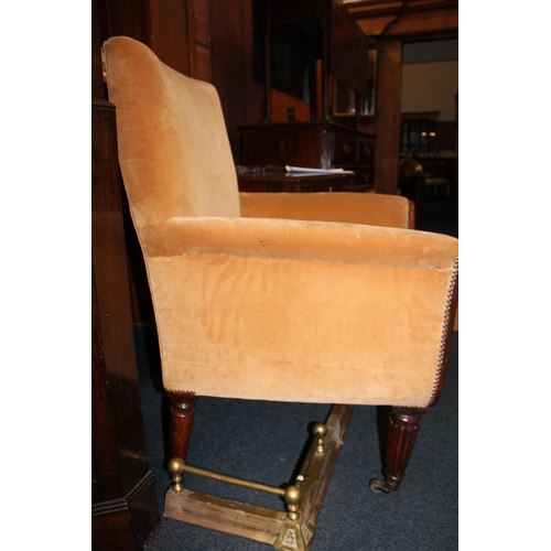 545 - Antique mahogany armchair, raised on fluted supports with brass castors.