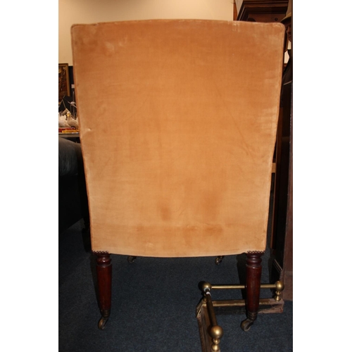 545 - Antique mahogany armchair, raised on fluted supports with brass castors.