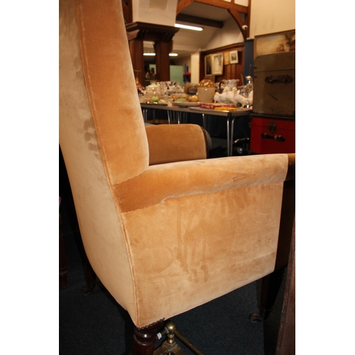 545 - Antique mahogany armchair, raised on fluted supports with brass castors.