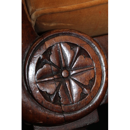 545 - Antique mahogany armchair, raised on fluted supports with brass castors.