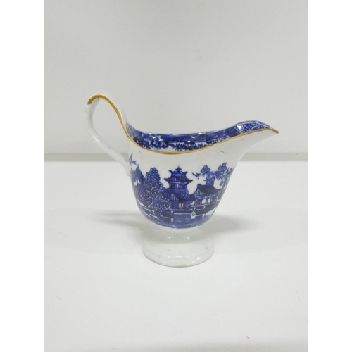 26 - New Hall helmet shape jug printed in blue with a rare version of 