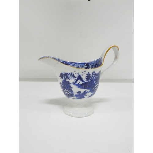26 - New Hall helmet shape jug printed in blue with a rare version of 