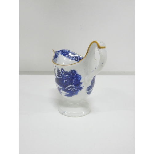 26 - New Hall helmet shape jug printed in blue with a rare version of 