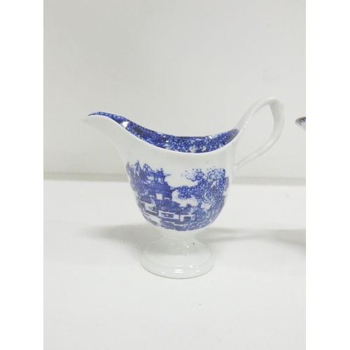 49 - Two New Hall helmet shape jugs, c1785/90, printed in blue with the 