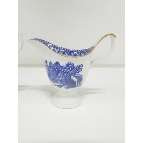 49 - Two New Hall helmet shape jugs, c1785/90, printed in blue with the 