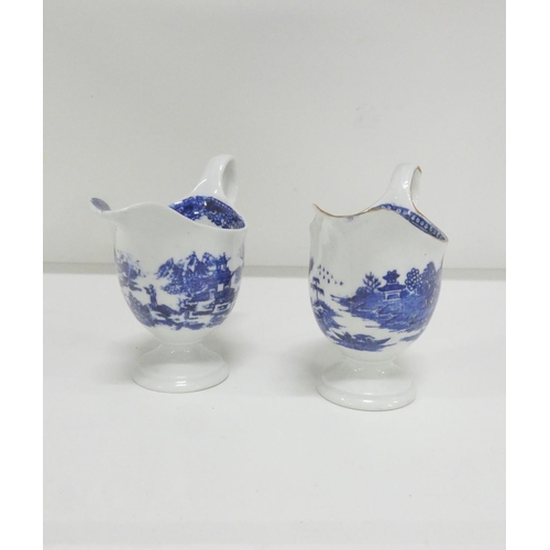 49 - Two New Hall helmet shape jugs, c1785/90, printed in blue with the 